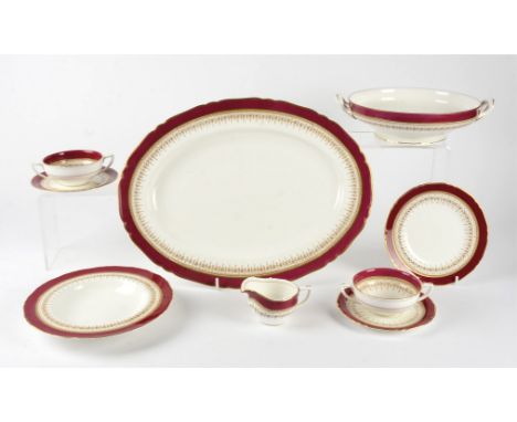 A Royal Worcester 'Regency' pattern part dinner service, in red, consisting of 7 large plates, 8 medium plates, 3 tea plates,