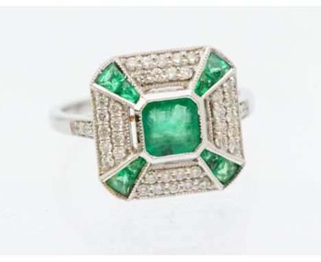 An emerald and diamond 18ct white gold  cluster ring, comprising a square cut emerald to the centre, measuring approx 5x5mm, 