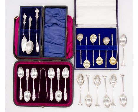 A collection of cased and other silver spoons to include; a set of six cased Russian silver gilt condiment spoons, having nie