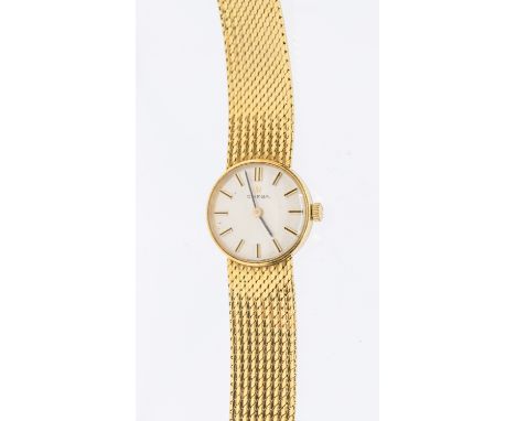 Omega- a ladies 18ct gold wristwatch, comprising a round silvered signed dial with applied gilt baton hour markers, case appr