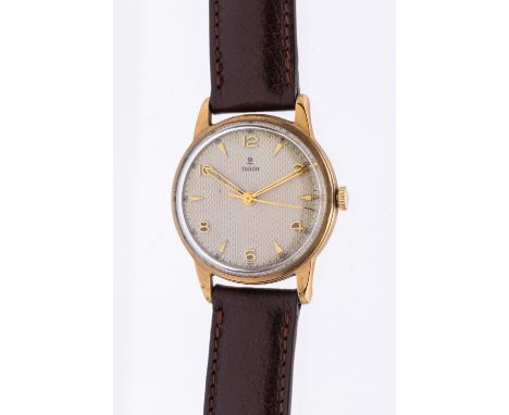Tudor- a gentleman's 9ct gold wristwatch, circa 1950's,comprising a round signed champagne honeycomb dial with applied gilt q