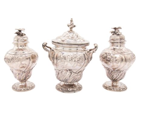 A pair of George III silver tea caddies / canisters and matched two handled sugar box and cover, the ogee bodies each chased 
