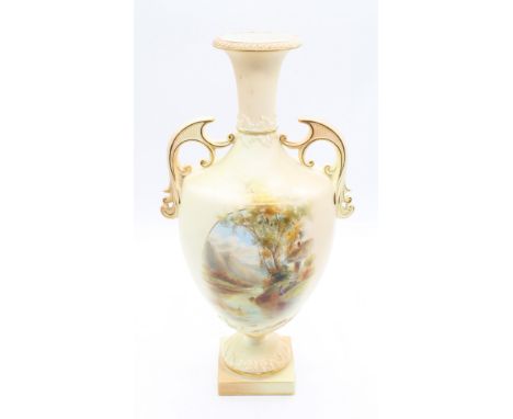 A Royal China Works Worcester blush ivory two handled urn shaped vase, with hand painted lakeside and mountain view scene, gi