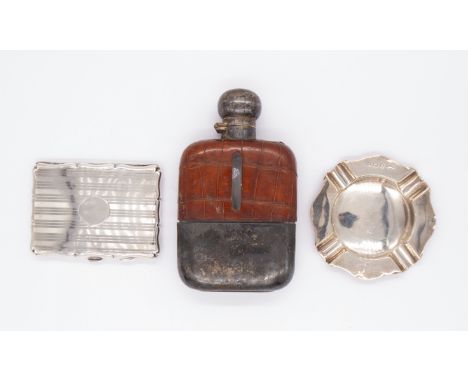 An Edwardian silver and crocodile leather mounted hip flask, the silver hallmarked by James Dixon & Sons, Sheffield, 1928, to