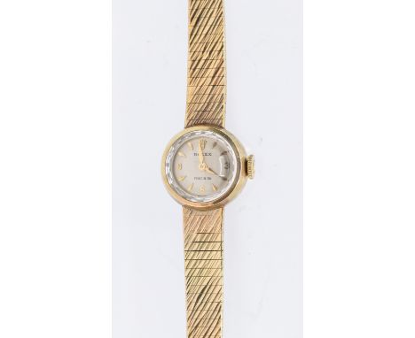 Rolex- a ladies vintage 9ct gold cocktail wristwatch, comprising a round silvered dial with applied quarter Arabic indices an