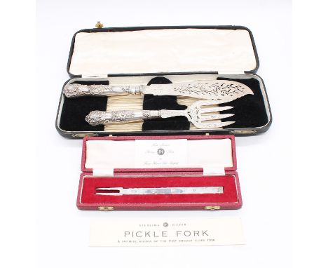 A Victorian cased fish serving knife and fork set, having pierced and engraved leaf and foliage designs and engraved Greyhoun