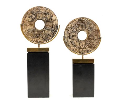 A pair of Chinese carved jade bi discs in archaic style, 20th century, of dark brown/green hue, worked in low relief with geo