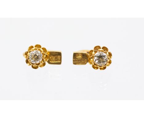 A pair of Chinese gold and diamond set earrings, each comprising an old cut diamond, combined total diamond weight  approx 1.