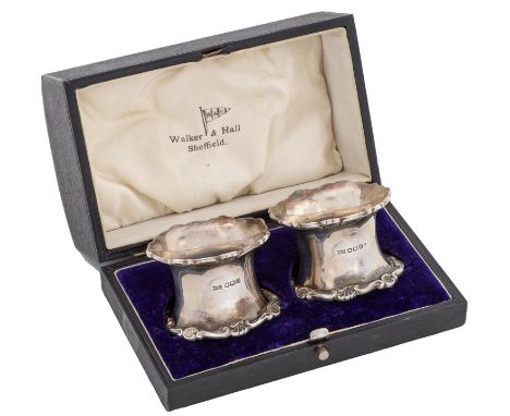 A pair of George V silver napkin rings, spool shaped, with applied border, by Walker &amp; Hall Ltd, Sheffield 1931, cased, 2