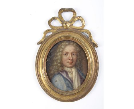 British School, early 18th c - Portrait miniature of a Gentleman, in a blue coat, oil on copper, oval, 62mm, 18th c copper gi