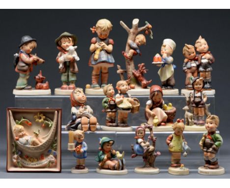 Fifteen Goebel figures of children and a plaque, modelled by M J Hummel, various sizes, printed marks ConditionGood condition