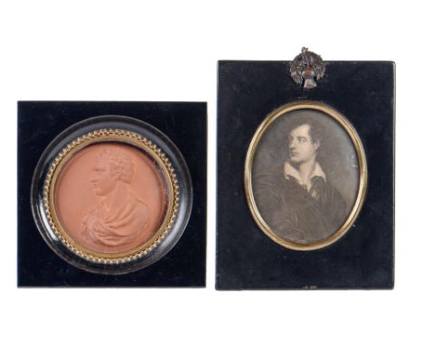 A terracotta portrait medallion of Lord Byron, 76mm diam, in giltmetal surround and ebonised square frame and a stipple engra