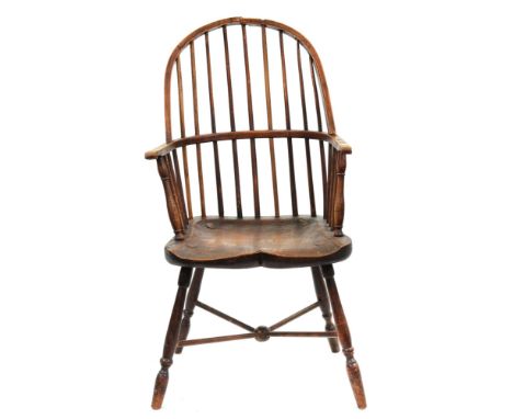 A spindle back Windsor armchair, first half 19th c, of ash with shaped elm seat, on splayed legs with spindle X-stretcher, se