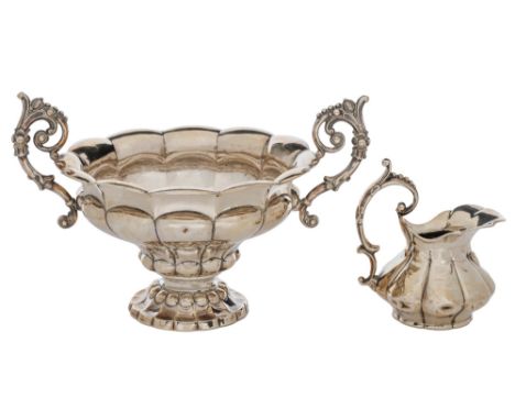 A French silver cream jug and sugar bowl, mid 19th c, of lobed form with leafy, beaded scroll handles, bow 14.5cm h, marks ru