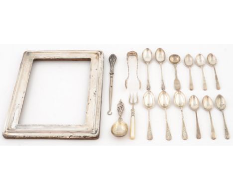 A silver photo frame and miscellaneous coffee spoons and other articles, early 20th c and a contemporary German silver caddy 