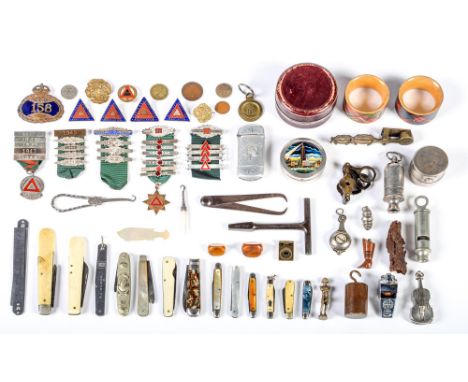 A Royal Mail brass and blue enamel postman's cap badge, a Victorian brass sovereign balance, silver fruit knife with mother o