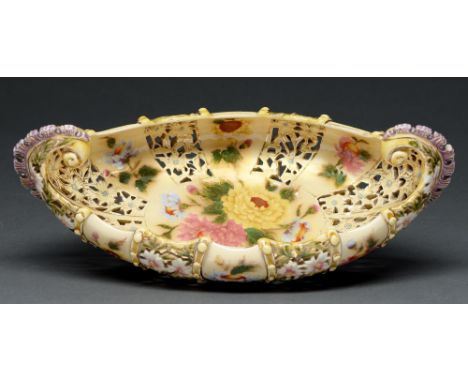 A Zsolnay pierced and scroll handled bowl, late 19th c, decorated with flowers and gilt, 35cm l, impressed and printed Five T