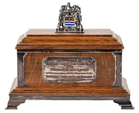 Corporation of Newark. A George VI silver mounted oak freedom casket, the moulded lid surmounted by the enamelled Arms of New