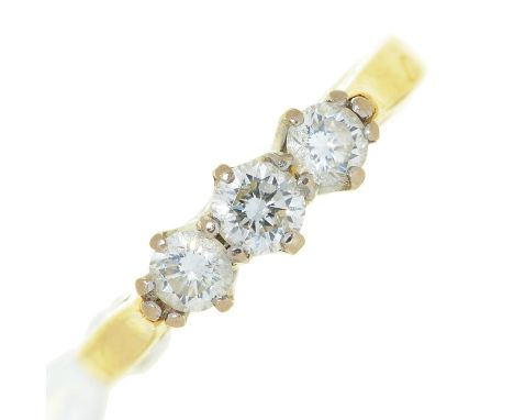 A three stone diamond ring, in gold, marked DIA .50 18CT, 3.2g, size J Condition