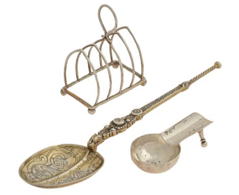 An Edwardian silver cigar rest, 90mm l, by Haseler Bros, Chester 1901, an Edwardian silver wirework toast rack and an Edward 