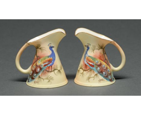 A pair of Locke &amp; Co Worcester jugs, c1900, painted by J Lewis, both signed, with a peacock, 8.5cm h, printed mark Condit