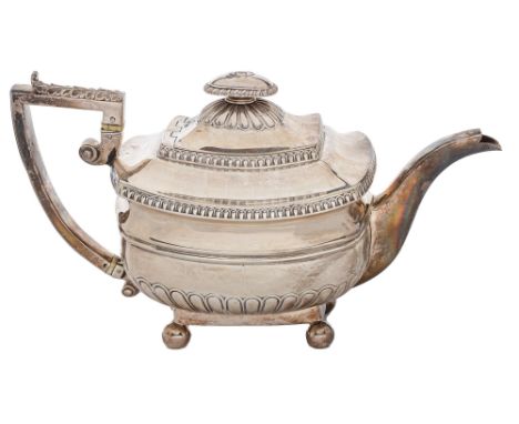 A George III silver teapot, with acanthus capped handle and integral joint, on ball feet, 15cm h, by Thomas Robinson, London 