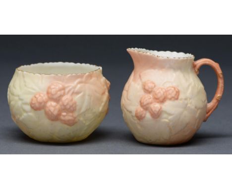 A Locke &amp; Co Worcester cream jug and sugar bowl, c1900, ovoid and moulded with brambles in shaded apricot and gilt, jug 7