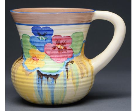 Clarice Cliff.&nbsp; An A J Wilkinson Pansies jug, 1932, 18cm h, printed mark, painted Pansies, moulded shape No 635 Provenan