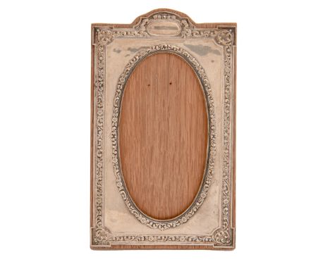 An Edwardian silver photograph frame, with die stamped neo classical style mount backed on wood with strut, 19.5cm h, by Henr