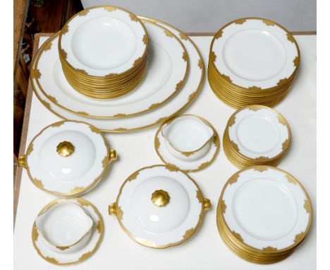 A Limoges white and gold dinner service, second quarter 20th c, largest dish 51cm l, printed marks, including that of the ret