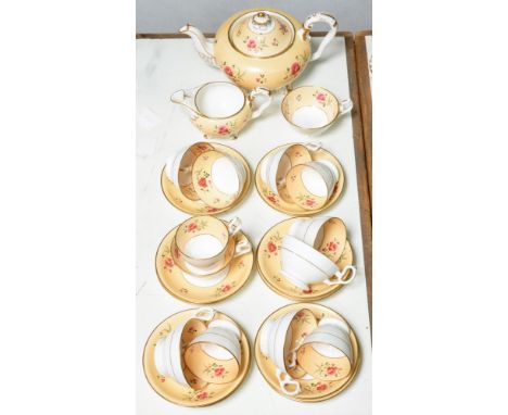 An H &amp; R Daniel tea and coffee service, c1828, of plain edged shape, painted with pink flowers on an apricot band and gil