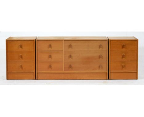 A pair of Stag light oak bedside chests and a chest of drawers en suite, c1970, pair 68cm h; 43 x 47cm, maker's label Conditi