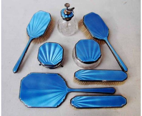 A cut glass Perfume Atomiser, pear shape with silver and engine turned blue enamel top, pump action, 13cm high, together with