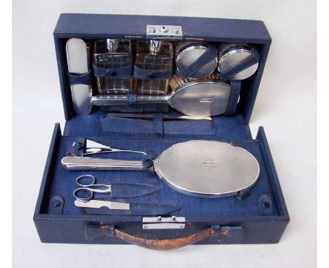 An Art Deco blue cased silver mounted Ladies Travelling Set by Mappin and Webb circa 1936, contains silver topped bottles and