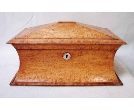 An early 19th century birds eye maple Tea Caddy of rectangular waisted form, hinged pagoda style lid, mother of pearl escutch
