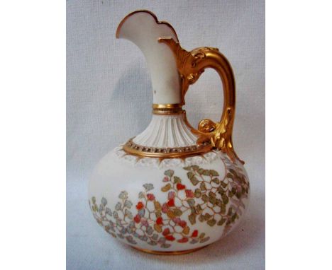 A Royal Worcester blush ivory porcelain Ewer of compressed form, pattern number 1136, decorated with gilt highlighted floral 