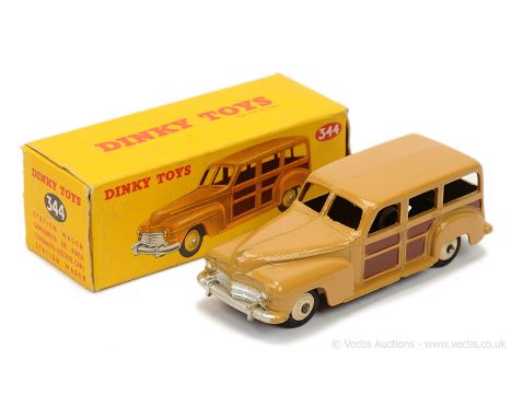 Dinky 344 Plymouth Estate Car - tan body, dark brown side and rear panels, silver trim, light beige ridged hubs with black sm