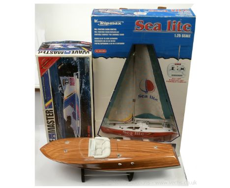 A group of boxed and unboxed model Boats - to include (1) Ripmax radio controlled Sea Lite 1/25th scale Yacht - the vessel is