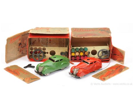Schuco (Germany) Telesteering Car 3000 - set contains a red clockwork car with figure, gears and brake together with 12 x woo