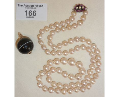 Genuine pearl necklace with diamond and ruby clasp, together with a bullseye agate ball pendant with 9ct gold fixings, neckla