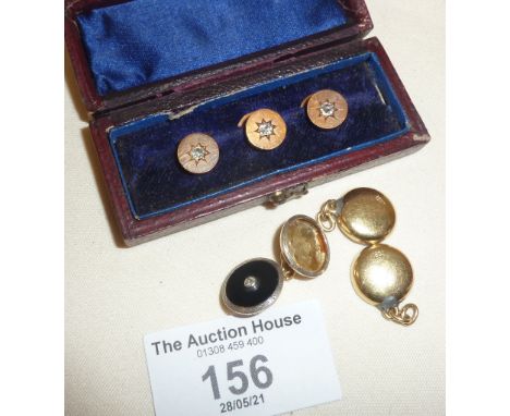 Yellow gold cufflinks marked as 18ct (one link missing black setting) and a set of three diamond studs in case