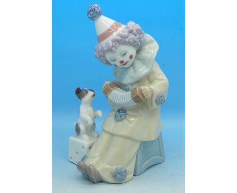 A Lladro figure, clown with squeeze box and dog, 5279