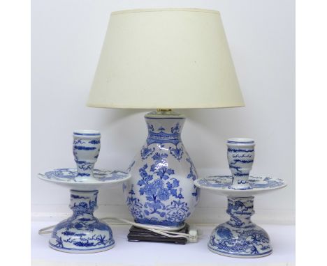 Two Chinese blue and white stands decorated with dragons and a Chinese lamp