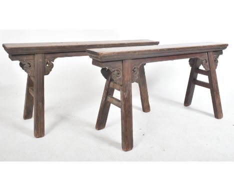 A pair of 19th century late Qing Chinese provincial elm wood refectory benches. The plain elm wood tops being raised on pairs