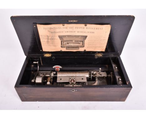 A 19th century Swiss rosewood and marquetry rectangular music box. The box having a chamfered edge hinged top, with cover inl