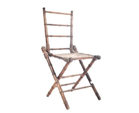 A French inspired early 20th century faux bamboo wooden folding child's chair. The chair having a ladder back rest over a rat