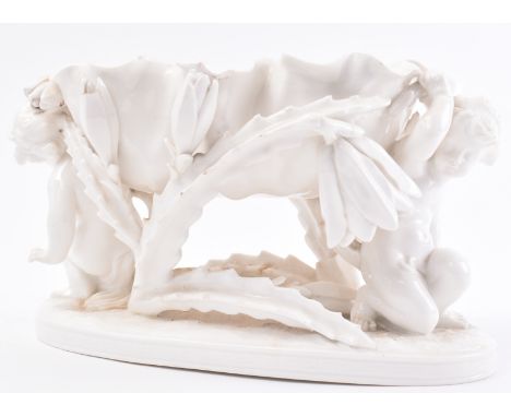 A 19th century blanc de chine figural group centrepieces by Moores Bros. The ceramic comport having a central crimped rim bow