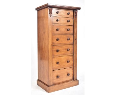 A Victorian 19th century mahogany upright Wellington chest of drawers. Raised on a plinth base with a bank of seven drawers h