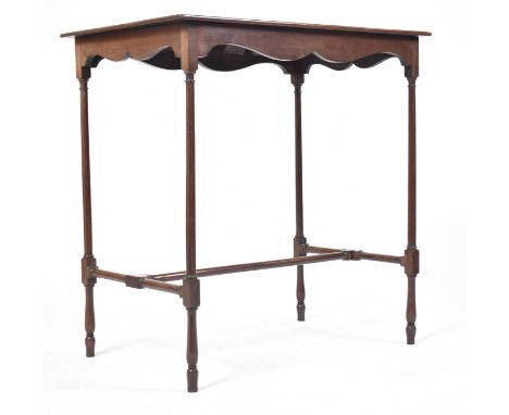A late 18th century George III Cuban mahogany side - lamp table. Raised on turned legs united by stretchers with block joints