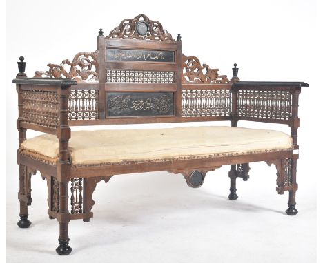 A late 19th century circa 1890s Syrian Islamic carved oak hall bench / settee. The bench having intricately carved &amp; pier